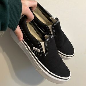 Women’s size 6 (men’s 4.5) black slip on vans.